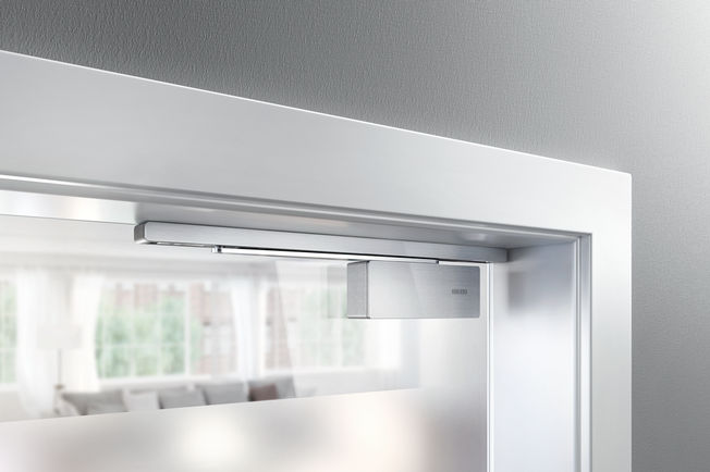 GEZE ActiveStop, surface mounted, glass door Draw-in damper on both sides for single-action doors without fire protection demands