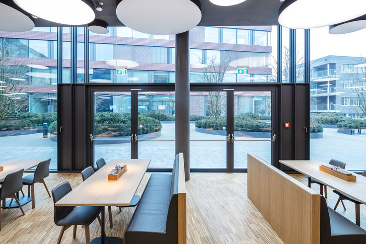 Staff restaurant with two double-leaf glass doors.