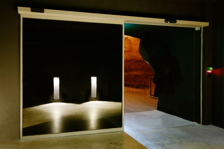 Entry to the replica caves with automatic Slimdrive SL NT sliding door system. Photo: Jean-Luc Kokel for GEZE GmbH