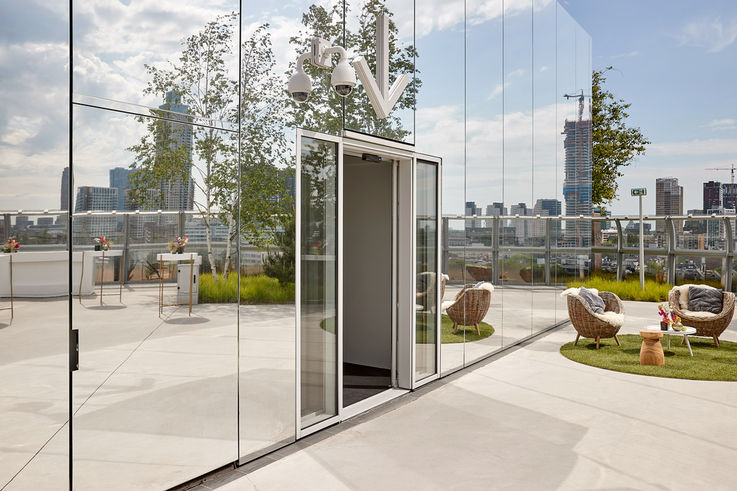 View of an open sliding door to the rooftop patio