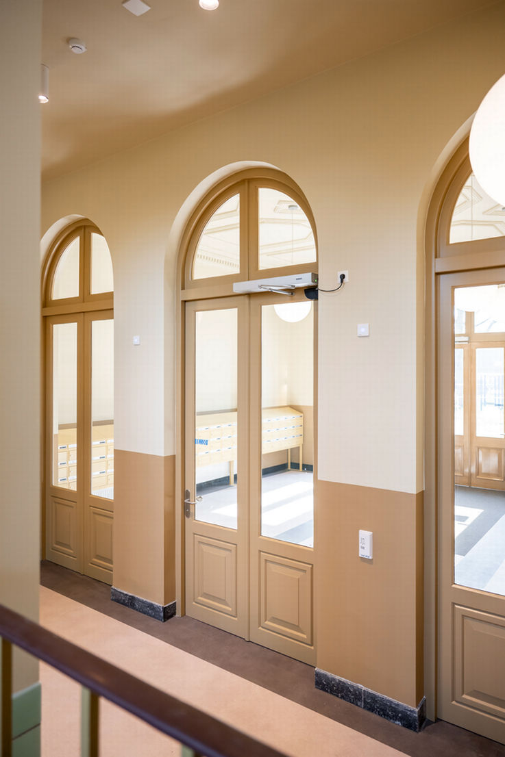 Interior view of HBS Kampen, glass doors with fanlights.