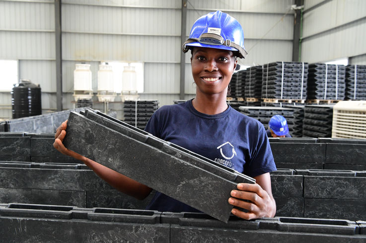 Yvonne Koffi, a 22 year old girl, at the factory of Conceptos Plasticos, in Yopougon, a suburban of Abidjan, in the south of Côte d'Ivoire. The young girl is working now for two months at the factory. Yvonne says: “I’m very happy to be part of a team of woman who make bricks from recycled plastic waste. It’s amazing that plastic waste becomes a school for children. It makes my happy. “ UNICEF Côte d’Ivoire has partnered with Columbian social business Conceptos Plasticos to turn plastic waste into construction materials for new schools. Research suggests that over the next 30 years, the world may produce four times more plastic than we ever have before. Finding innovative uses for plastic will become imperative to public health. Without plastic waste management, groundwater pollution may leave many communities without access to clean water. Plastic-clogged drains could continue to cause flooding and damage infrastructure. And air pollution from burning trash will pose major environmental and health risks. Because of their cost-effectiveness, durability, and ease-of-assembly, bricks made from 100% plastic waste have the potential to disrupt the conventional construction model and catalyze a market for recycled plastic worldwide. Millions of waste pickers working informally in landfills and on city streets around the world could become key waste management partners – elevated out of poverty as they help clean our planet, and provide building blocks for the futures of our children.